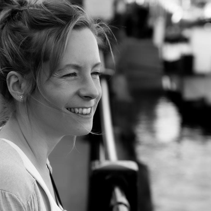 Kaveri Mehta, Lead Design Curator at Future Planning Method, reviewing corporate floral arrangements